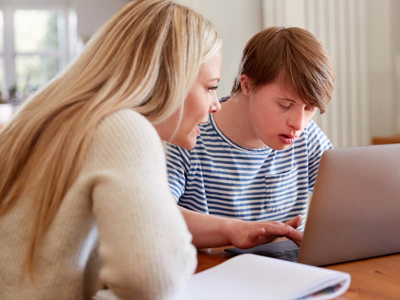 white secondary aged boy with DS